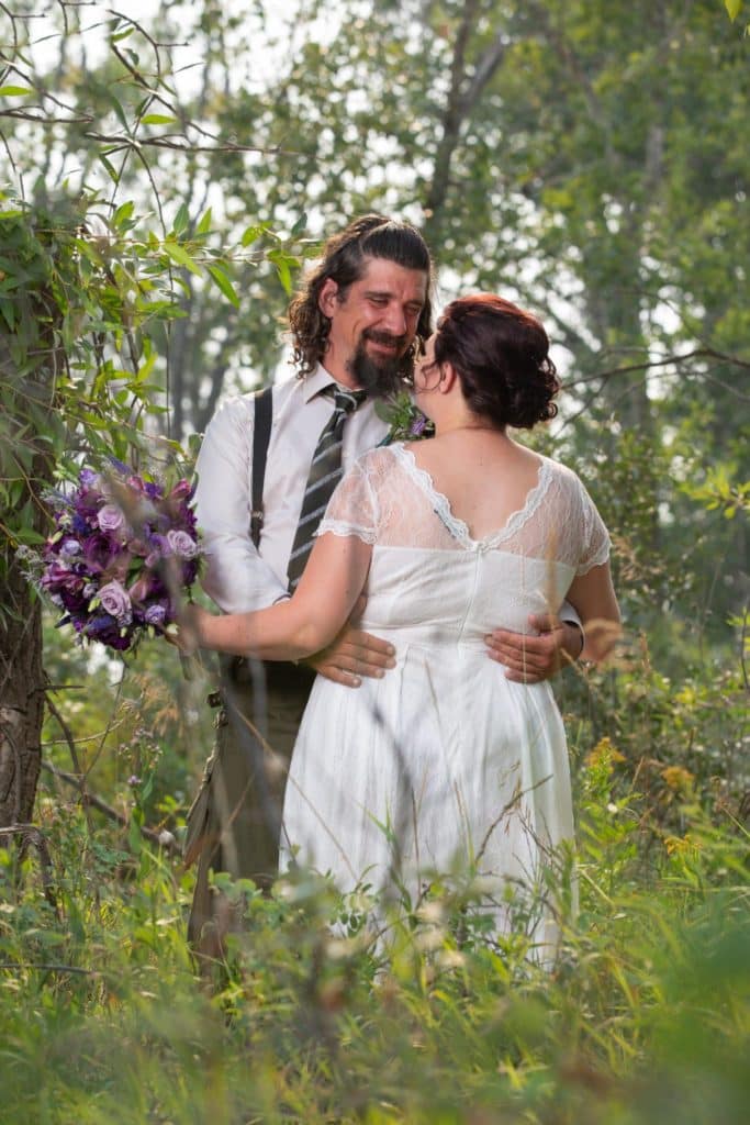 fort-macleod-wedding-photography-wedded-couple-in-the-trees-flowers